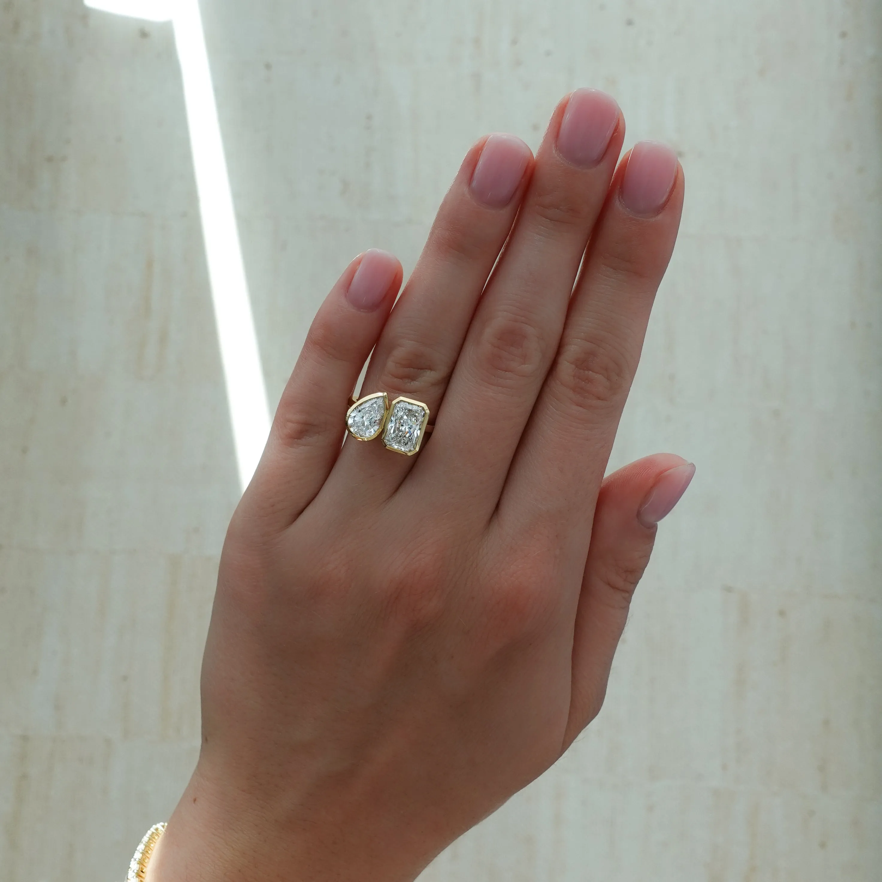 Toi et Moi Bezel Engagement Ring with Pear and Radiant Cut Diamonds